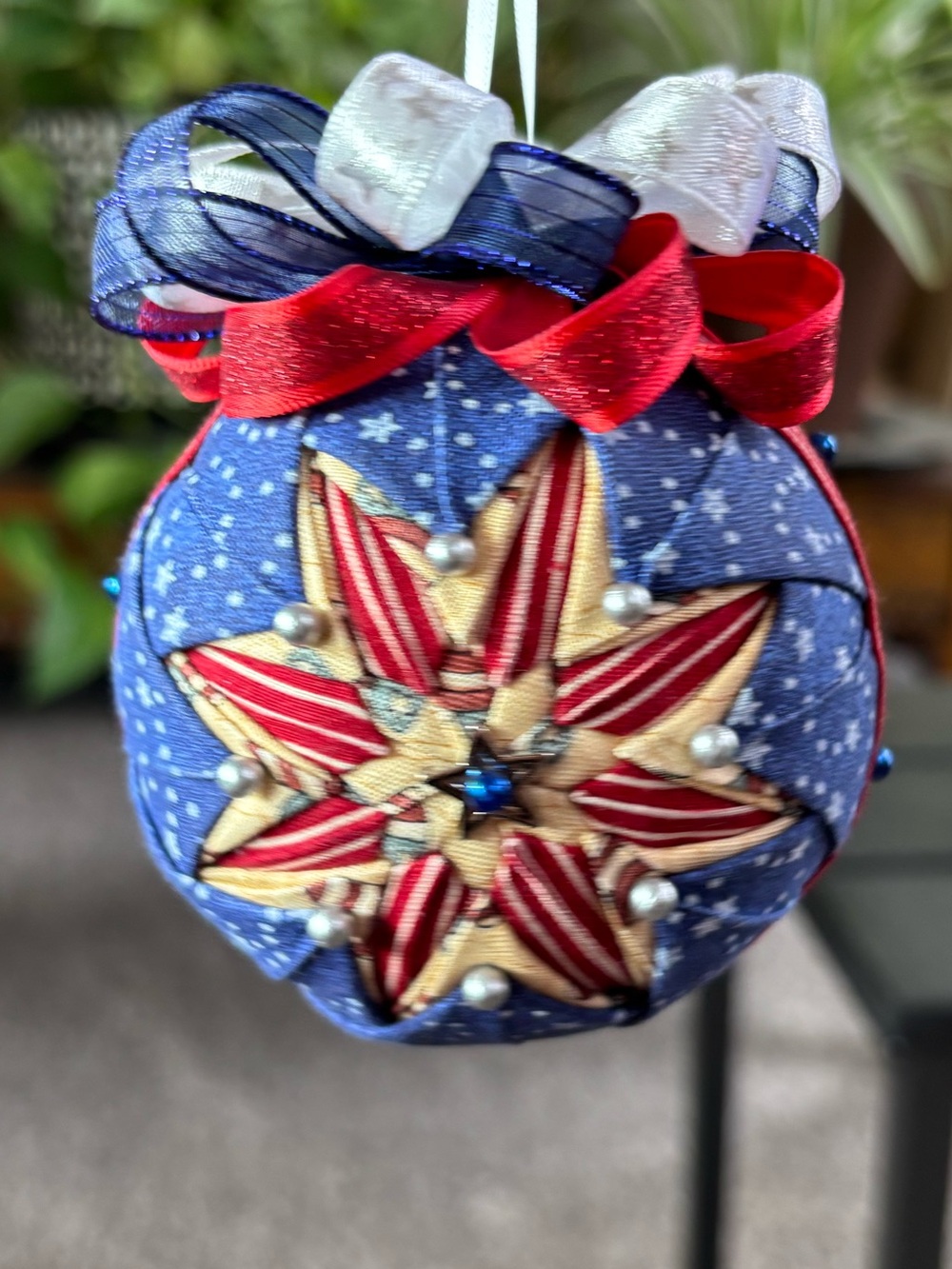 Patriotic Blue Quilted Star Ornament with Red Ribbon
